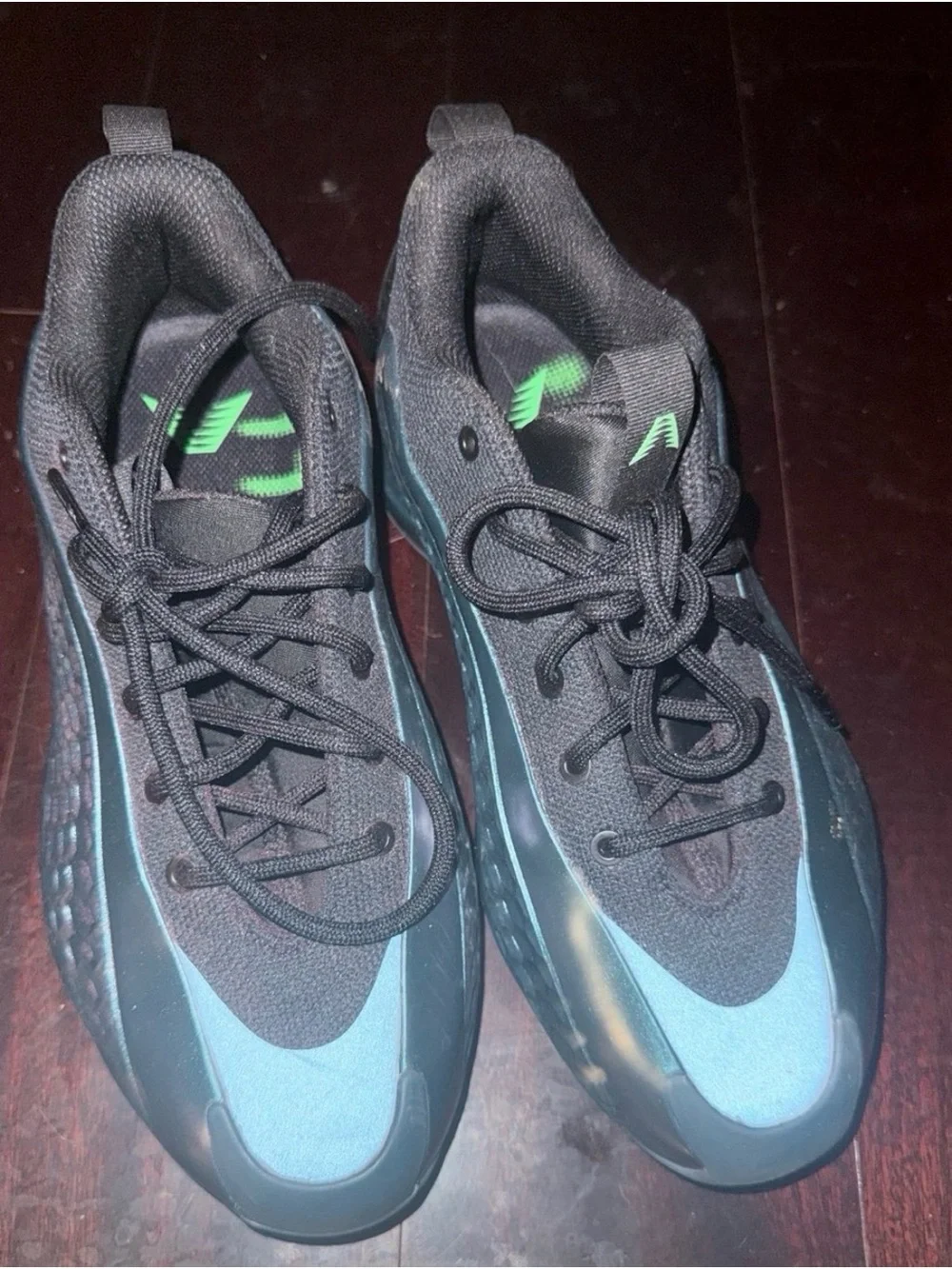 adidas Men's Black Sneaker with Iridescent Teal Accent